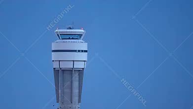 Air traffic control tower at airport at night