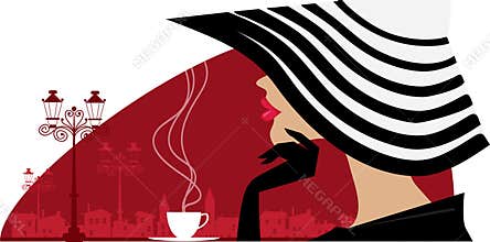 Stylish woman in a big hat at cafe