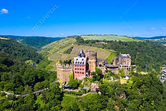 Drone photography from the famous Schönburg castle on the hilltop against blue sky.