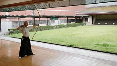 Kyudo practicing bow shooting in Kyoto, Japan.