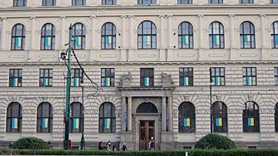 Ukrainian flags hanging in the windows of UMPRUM or Academy of Arts, Architecture and Design in Prague