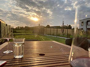 Garden during summer sunset, sprinkling water on perfect green lawn, grass, bowling green