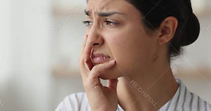 Unhappy Indian woman having life troubles closeup face view