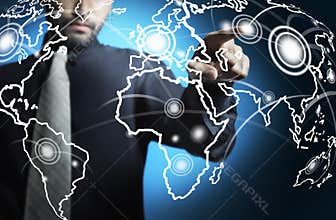 Business man touching world map digital screen
