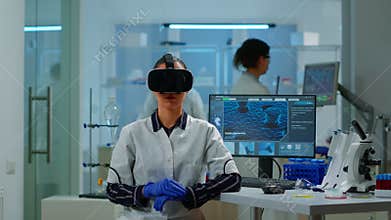 Laboratory doctor experiencing virtual reality using vr goggles