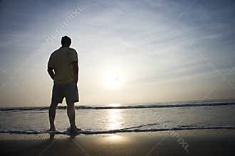 Man alone on beach.