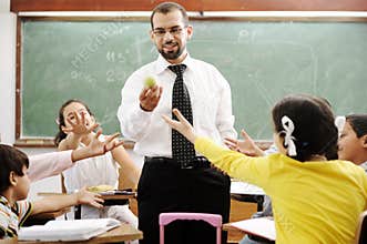 Young male teacher with children