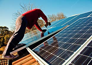 Fitting solar panels to roof of house