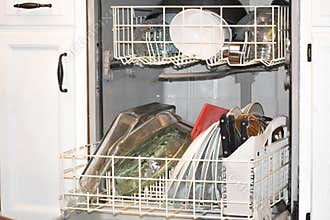 Loaded Dishwasher with Clean Dishes