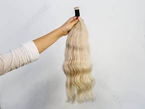 Bundle of blonde natural human hair extensions