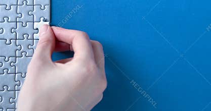 Grey puzzles isolated on grey background. Social issue concept