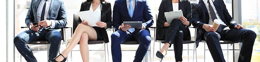 Five candidates waiting for job interviews, front view, crop
