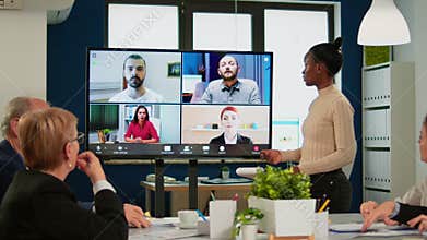 Black manager woman talking with remotely colleagues on video call