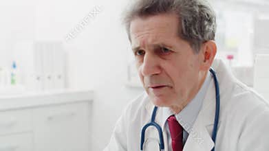 Handheld view of doctor talking with patients