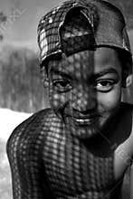 The dark eyes. Portrait of a little boy looking at his friend.