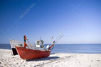 Two fishing boats on beach.