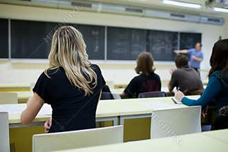Female college student sitting in a classroom