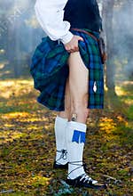 Legs of the man in kilt