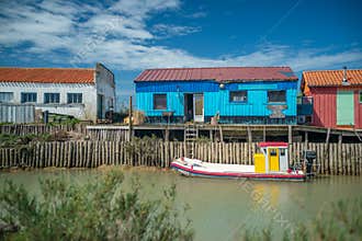 Oyster farm huts and boat at Charente Maritime