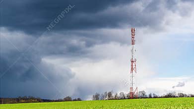 Clouds moving in sky above telecommunications tower