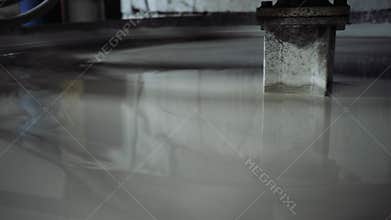 A large mixer mixes the ceramics, prepares the composition for production.