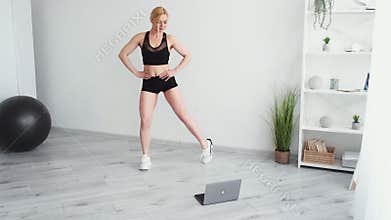 online aerobic athletic woman home training
