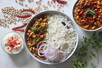 A gravy with white cowpea beans also known as black eyed pea. Served with steamed basmati rice and curd