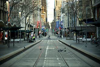 Melbourne in Lockdown July 2021 - empty city CBD streets - cyclist