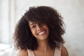 Mixed race happy female with perfect sparkling smiling.