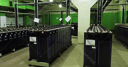 Rows of industrial storage batteries.A room used for backup or uninterruptible power supply.