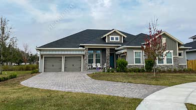 Panning left on the exterior of a luxury grey home in Orlando, Florida