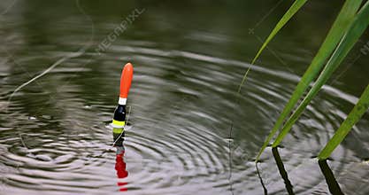 fishing bobber float throw in the water with splash