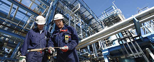 Oil workers and pipeline construction