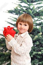 Happy children holds red box with bowknot
