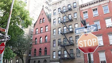 New York City building architecture. Urban residential house exterior. Real estate. Red brick facade