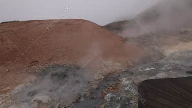 Drone areal video of empty geothermal Krysuvik area on Reykjanes peninsula in Iceland on early summer morning. Visible
