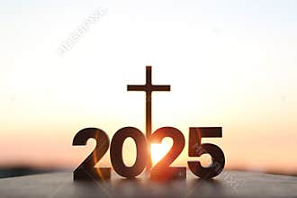 Brightly rising New Year\'s sunrise in 2025 with Jesus\' cross in the background
