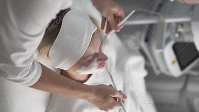 A calming beauty salon where a woman enjoys a rejuvenating facial