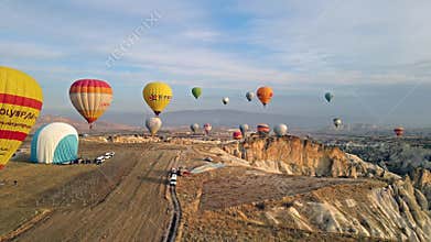 Drone footage with sunrise baloon flight over valley in Cappadocia, Turkey