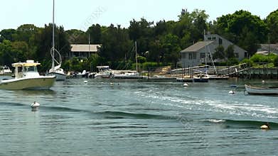 Boats leaving harbor; time-lapse