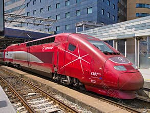 Brussels, Belgium - Jun 8 2024: A red Eurostar train engine standing at a platform at Brussels station in Belgium