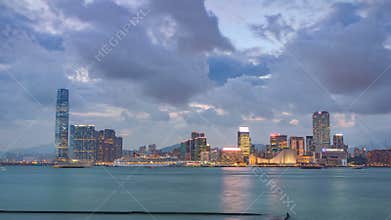 Skyline panorama timelapse day to night with International Commerce Centre in West Kowloon, Hong Kong.