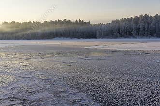 Ice floes and icicles on the lake surface