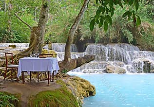 Dining in nature with turquoise blue waterfall to teach us to appreciate and take care of mother nature