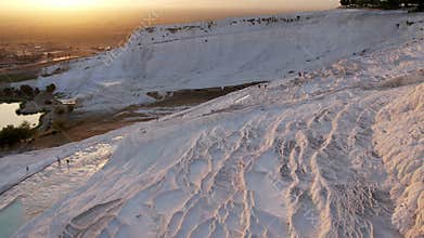 Aerial view of the travertines in Pamukkale in a beautiful sunset, Turkey. White limestone mineral formations. Turkish