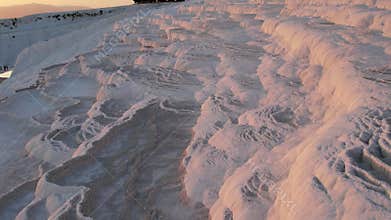 Aerial view of the travertines in Pamukkale in a beautiful sunset, Turkey. White limestone mineral formations. Turkish