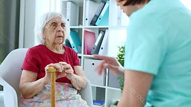 Doctor Explains Health Instructions To Elderly Woman
