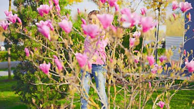 Portrait blond hair happy woman walks on street public park. Beauty girl fashion model smiling face enjoys spring nature