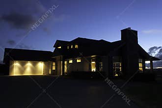 Modern house exterior with lighting at night