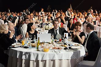People sitting at the tables during Ceremony of rewarding
